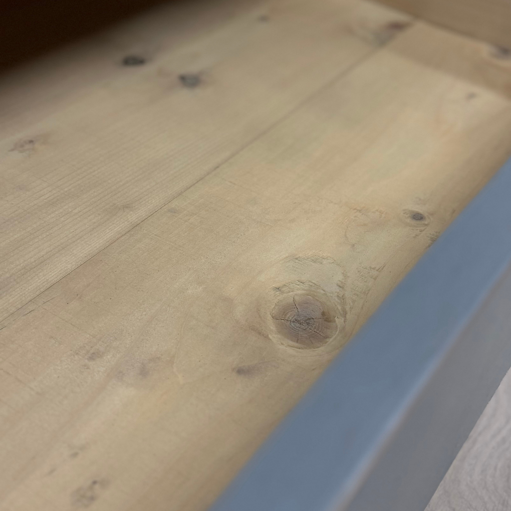 Close-up of a wooden surface with visible grain and texture