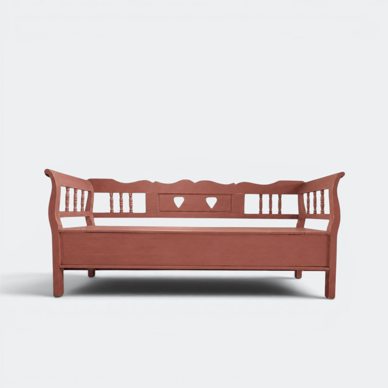 Two-metre handmade Dutch settle bench with hidden storage in distressed green solid pine, spindle sides and heart cut-outs, This Country Home Surrey