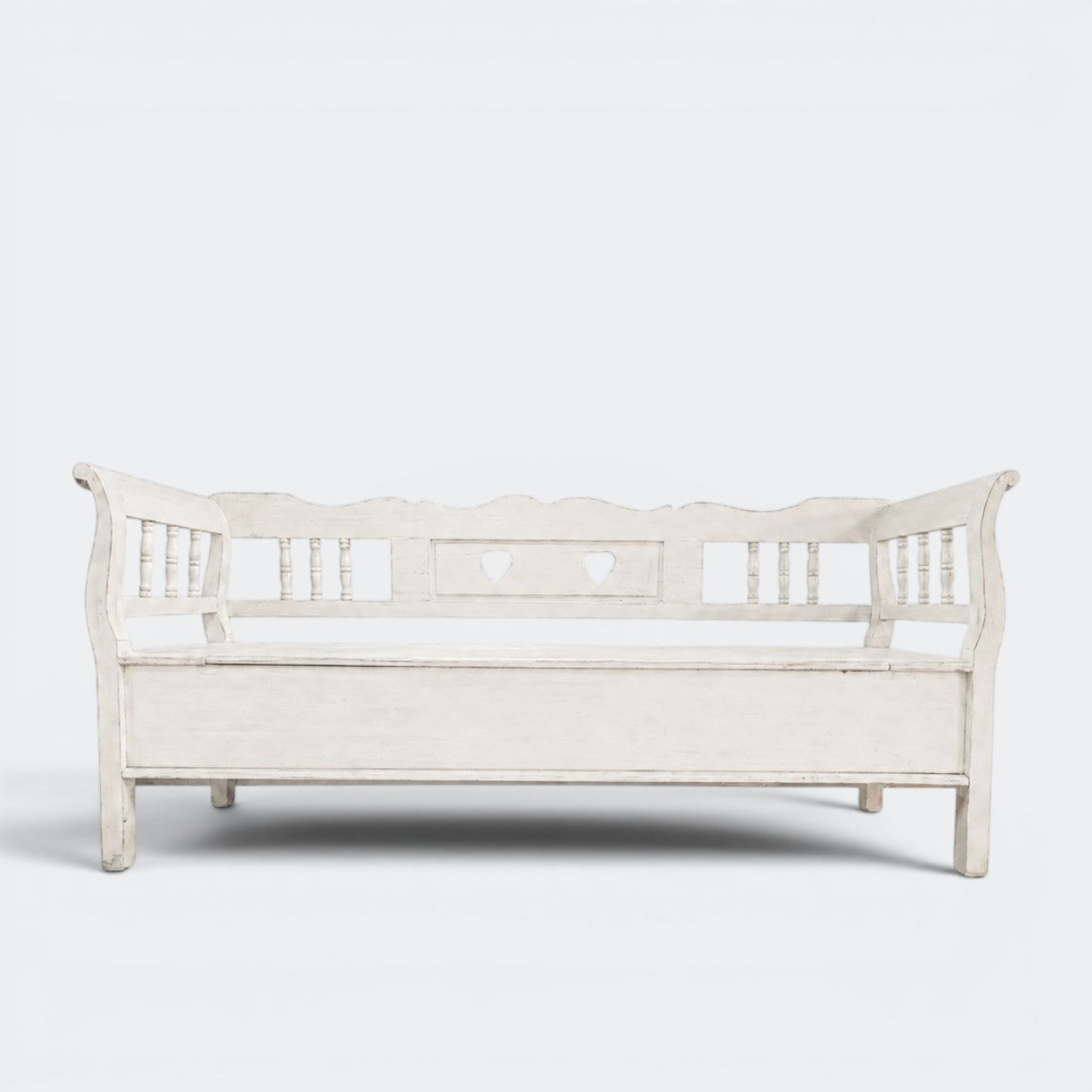 Two-metre handmade Dutch settle bench with hidden storage in distressed white solid pine, spindle sides and heart cut-outs, This Country Home Surrey