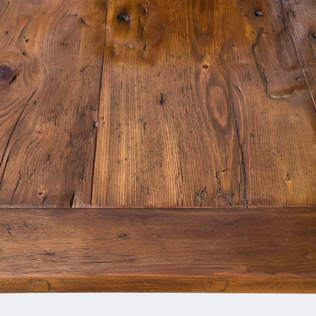 High-density old-growth reclaimed pine table top showing authentic 19th-century grain and historic patina.